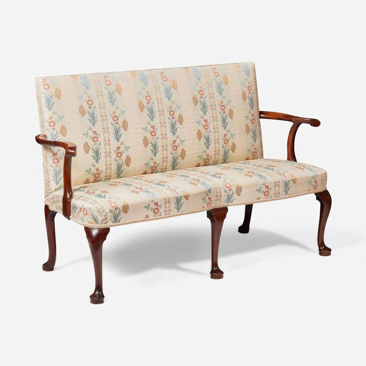 A George I carved walnut settee circa 1720