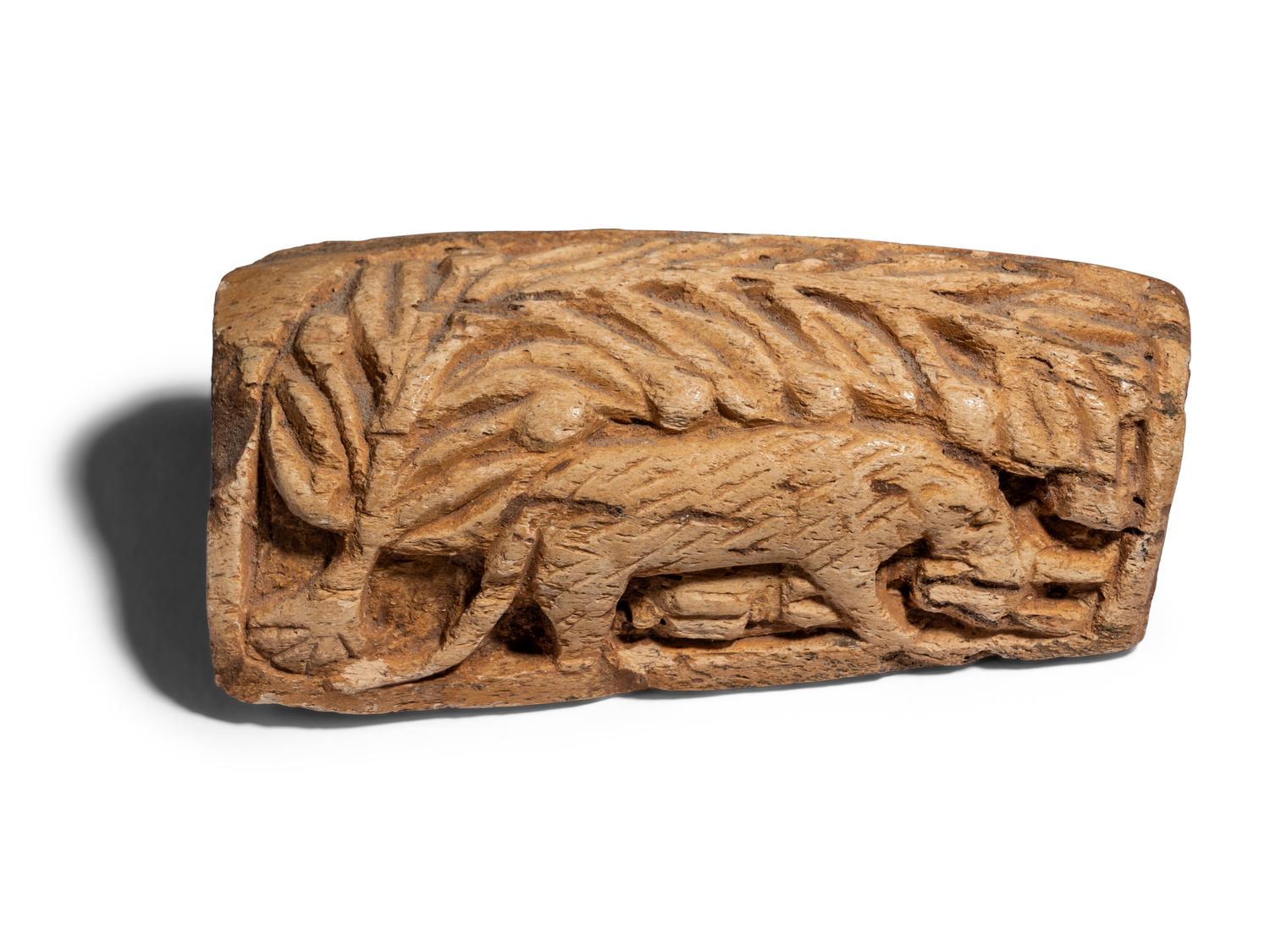 A Coptic Bone Fragment with a Lion Hunting Scene