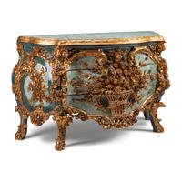 An Italian Carved, Painted and Parcel Gilt Commode