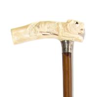 An American Sterling Silver, Carved Ivory and Cherry Cane, Height overall 36, width of handle 4 3/4 inches.