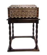 A Middle Eastern Ivory and Ebony Inlaid Table Casket, Width 18 1/5 inches.