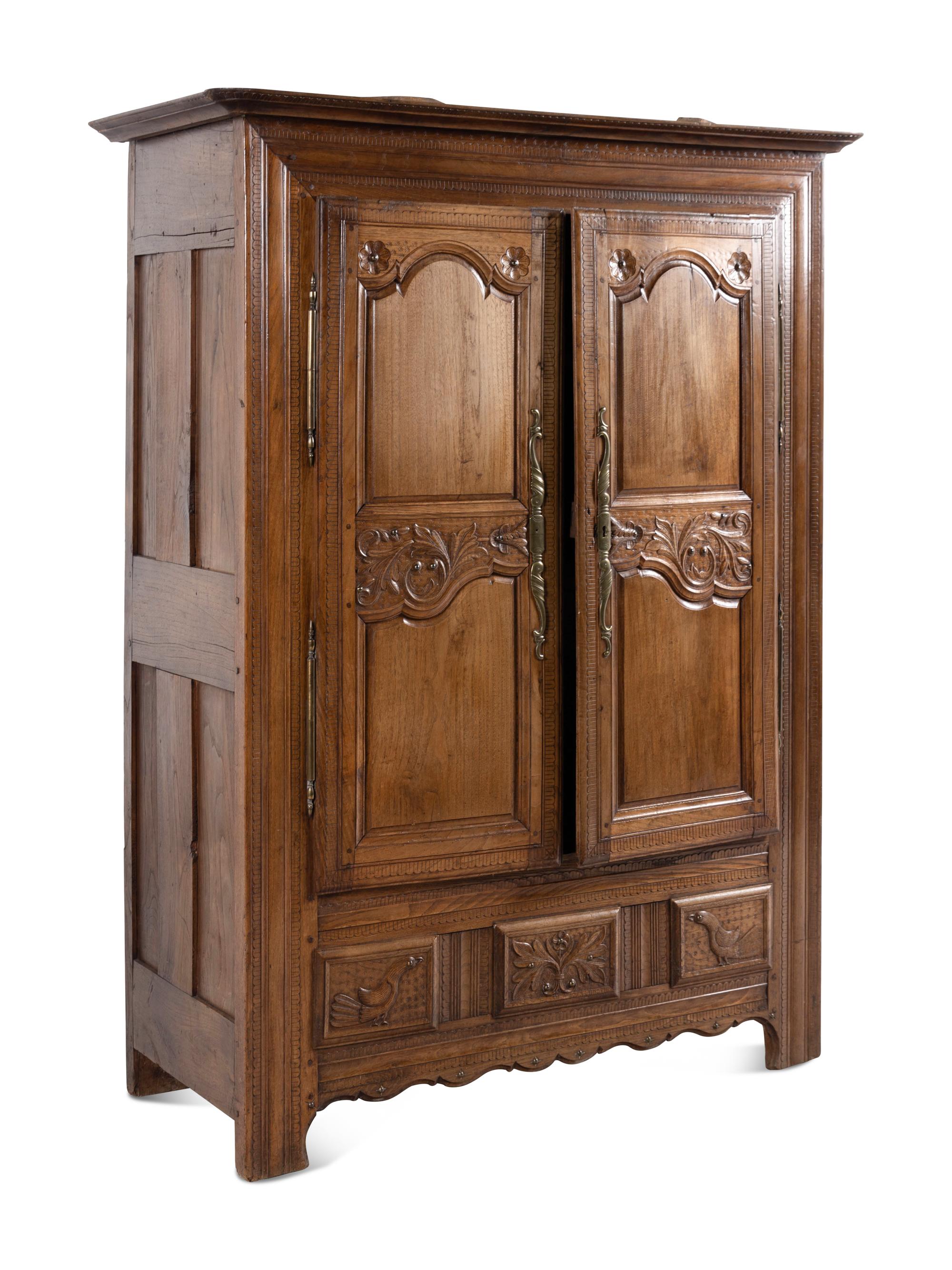 A French Carved Walnut Armoire