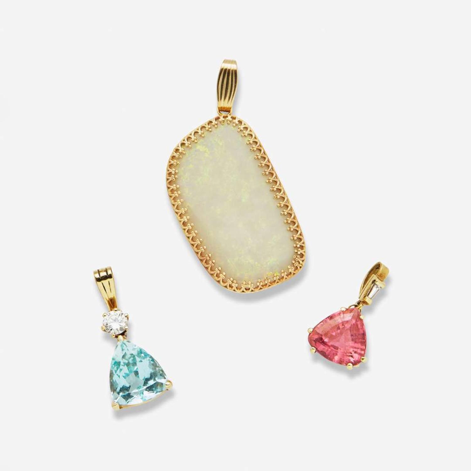 A Collection of Three 14K Yellow Gold and Gemstone Pendants