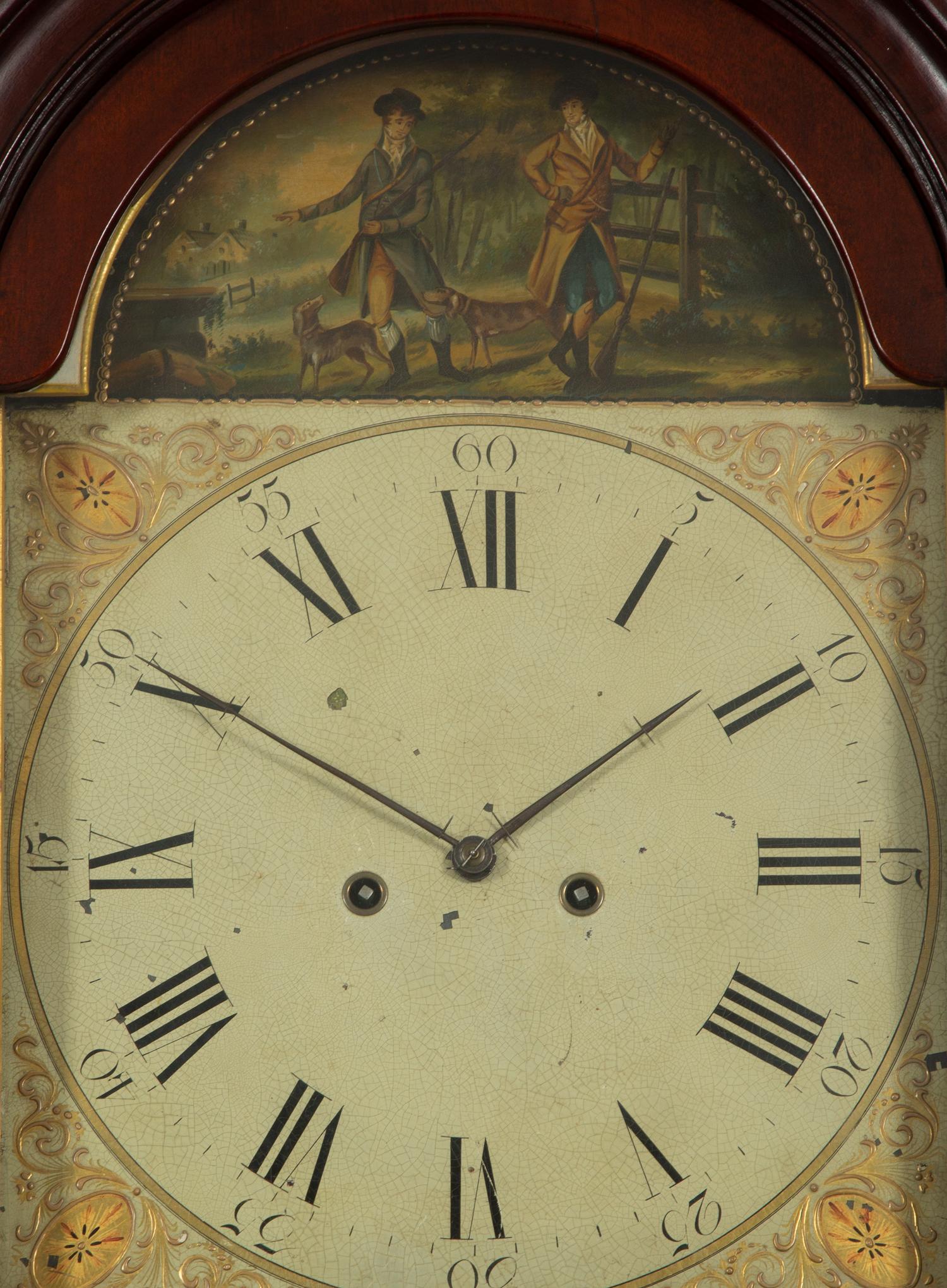 A Federal Carved, Inlaid and Figured Mahogany Tall Case Clock