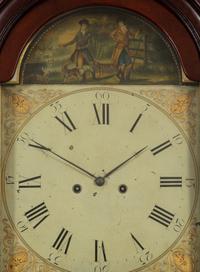 A Federal Carved, Inlaid and Figured Mahogany Tall Case Clock