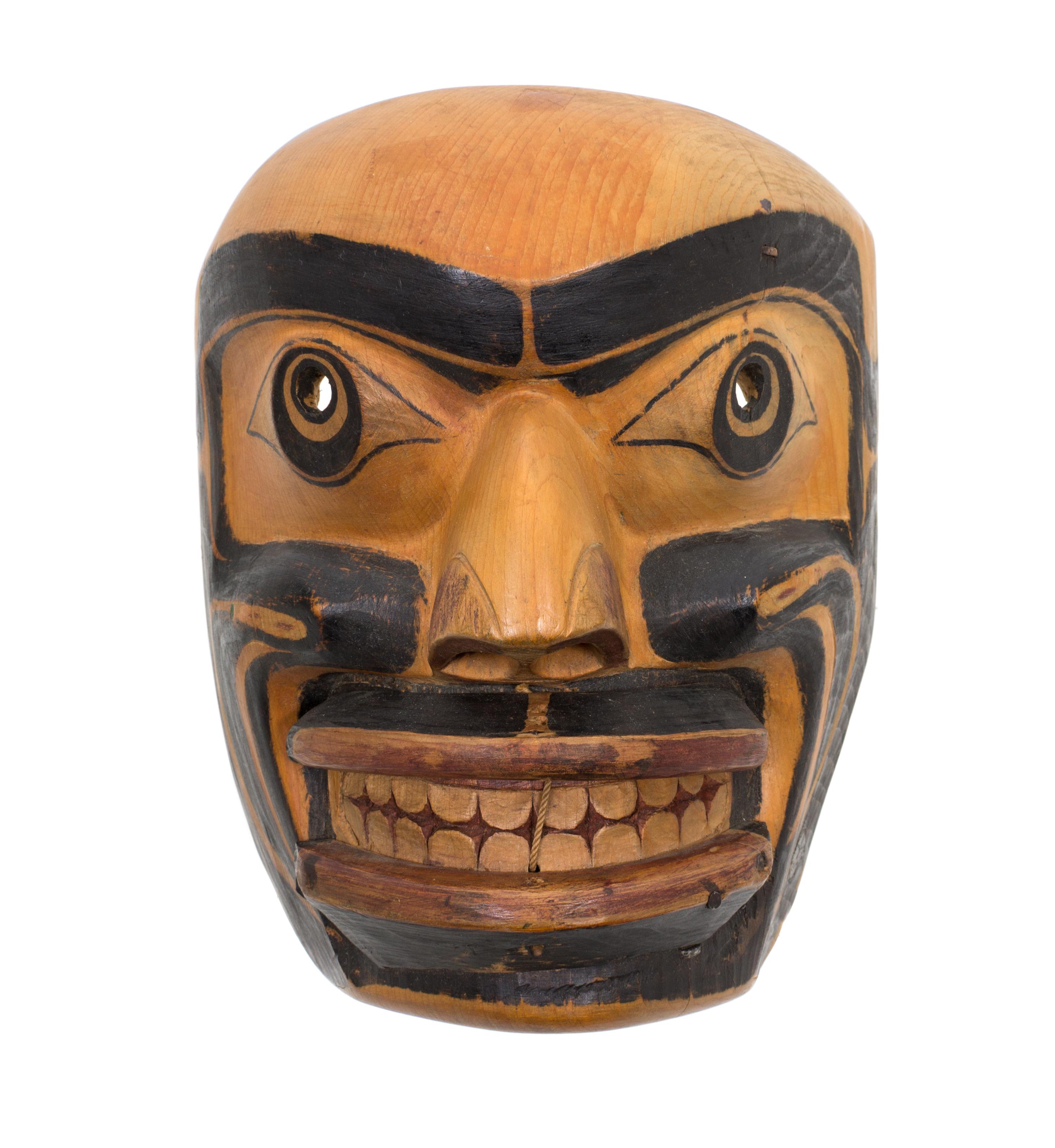 A Kwakwaka'wakw Painted Wood Mask Height 9 x width 8 x depth 5 1/2 inches. — EARLY 20TH CENTURY