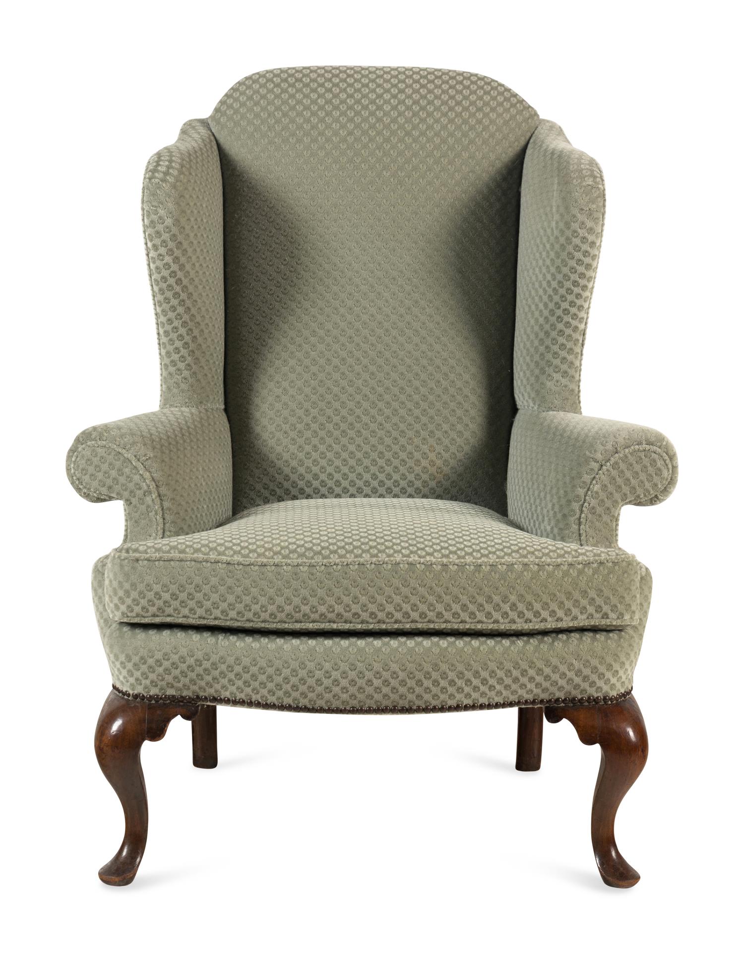 A Queen Anne Style Mahogany Wing-Back Armchair