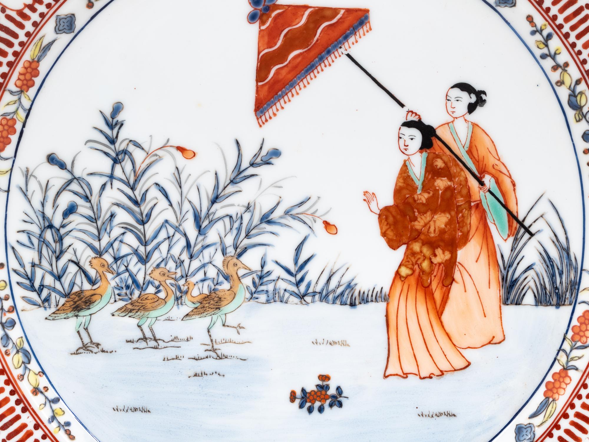 A Set of Eight "Pronk Dame au Parasol" Porcelain Chargers