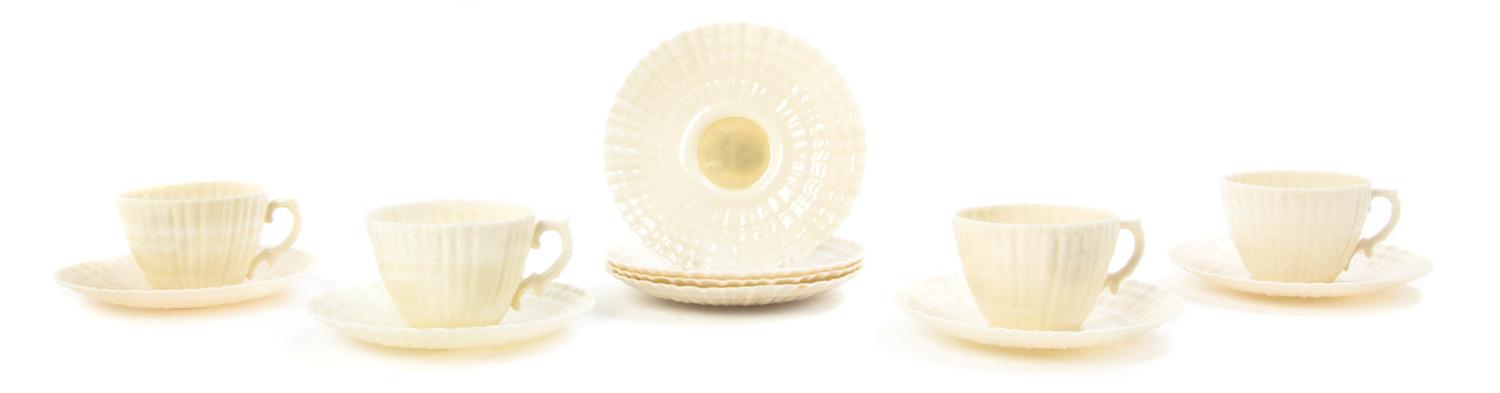 A Belleek Porcelain Tea Service for Four, Width of first over handle 10 3/4 inches.