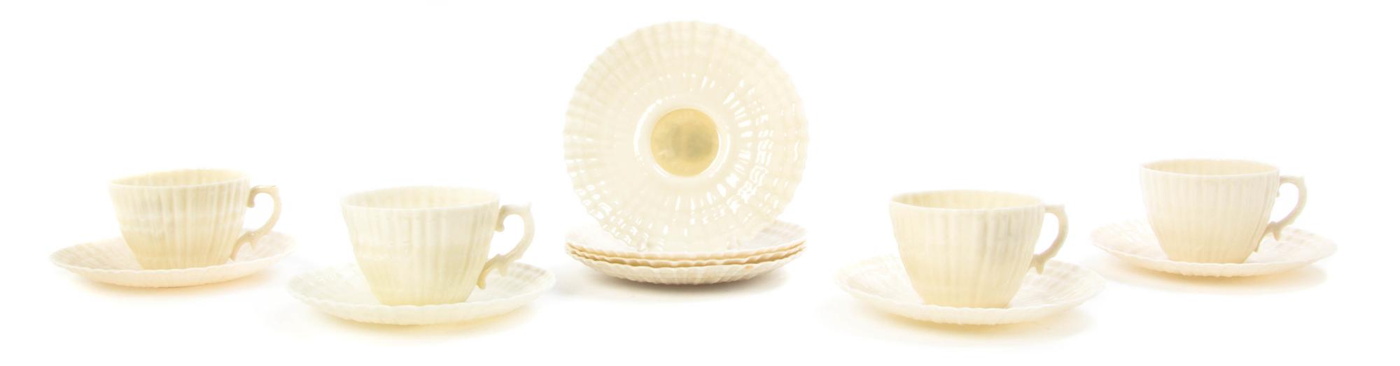 A Belleek Porcelain Tea Service for Four, Width of first over handle 10 3/4 inches.