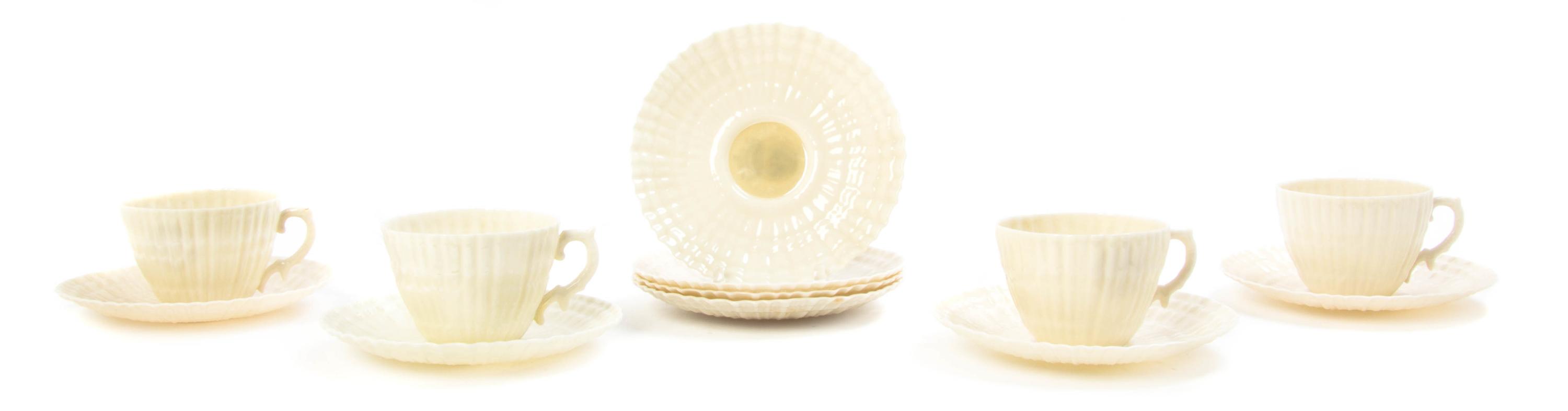 A Belleek Porcelain Tea Service for Four, Width of first over handle 10 3/4 inches.