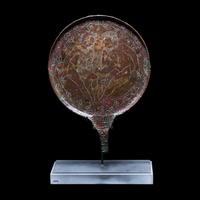 An Etruscan Bronze Mirror with Incised Scene of Hercules and Apollo
