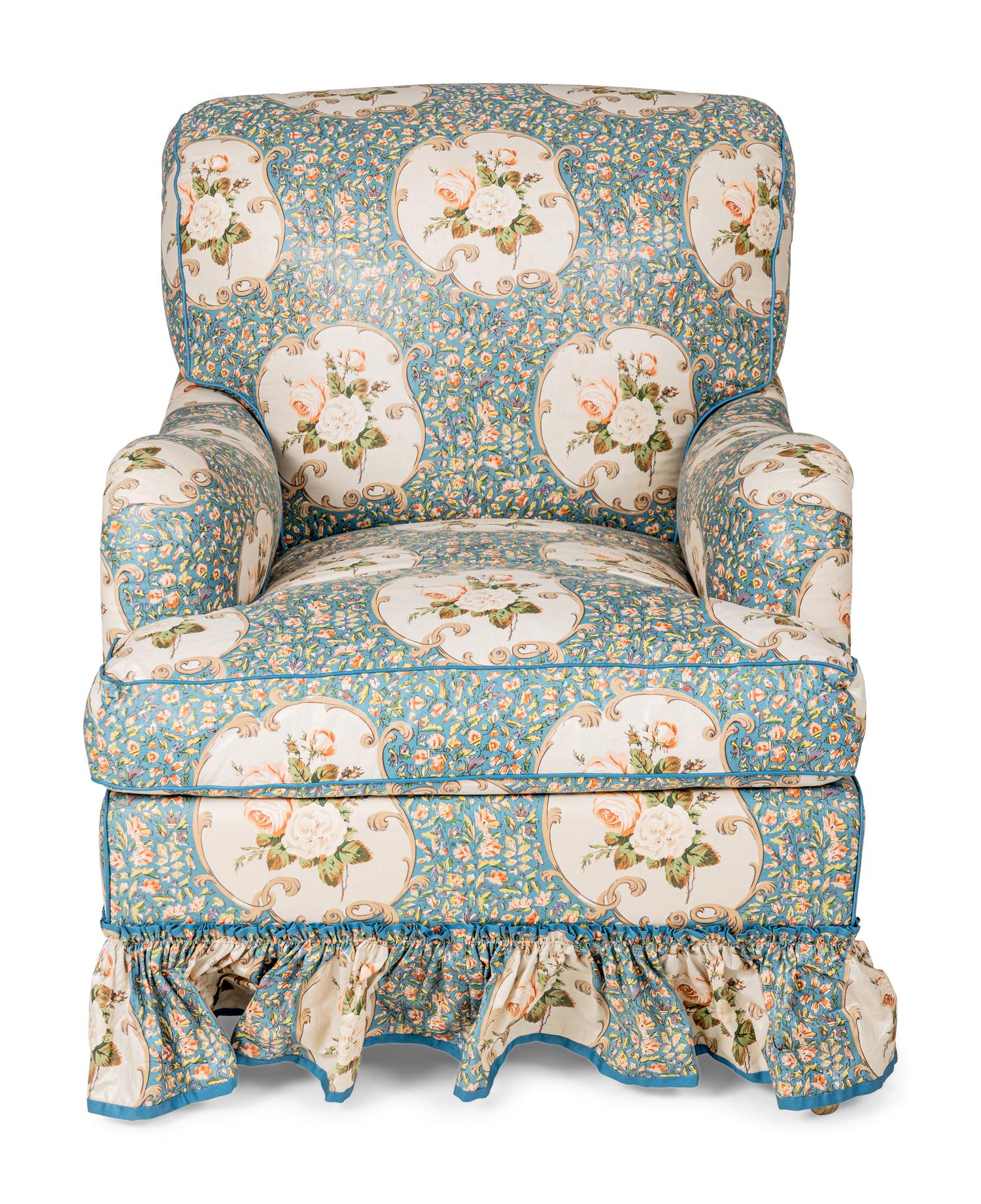An English Chintz-Upholstered Easy Chair and Ottoman