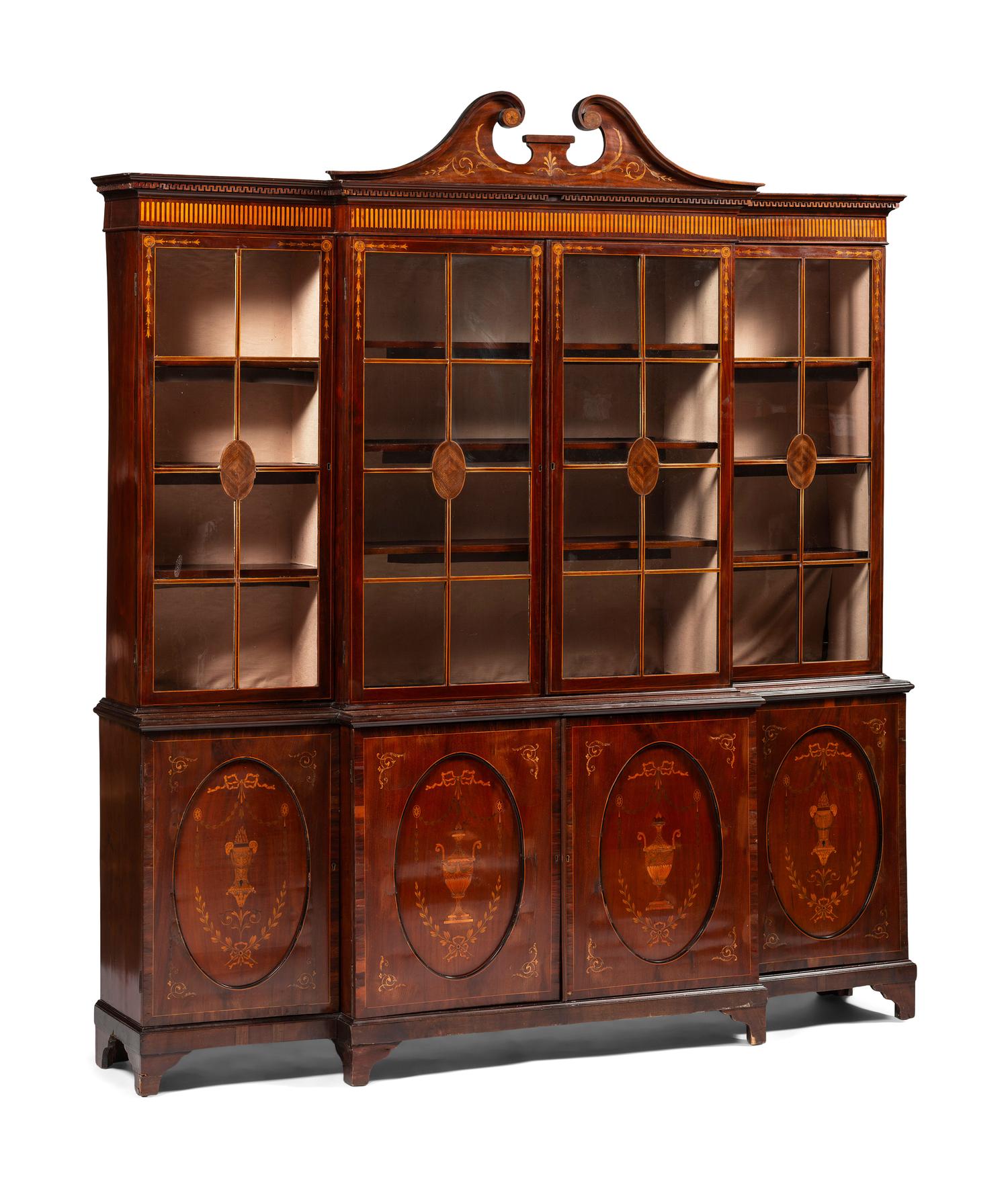 An English Mahogany and Marquetry Breakfront Bookcase