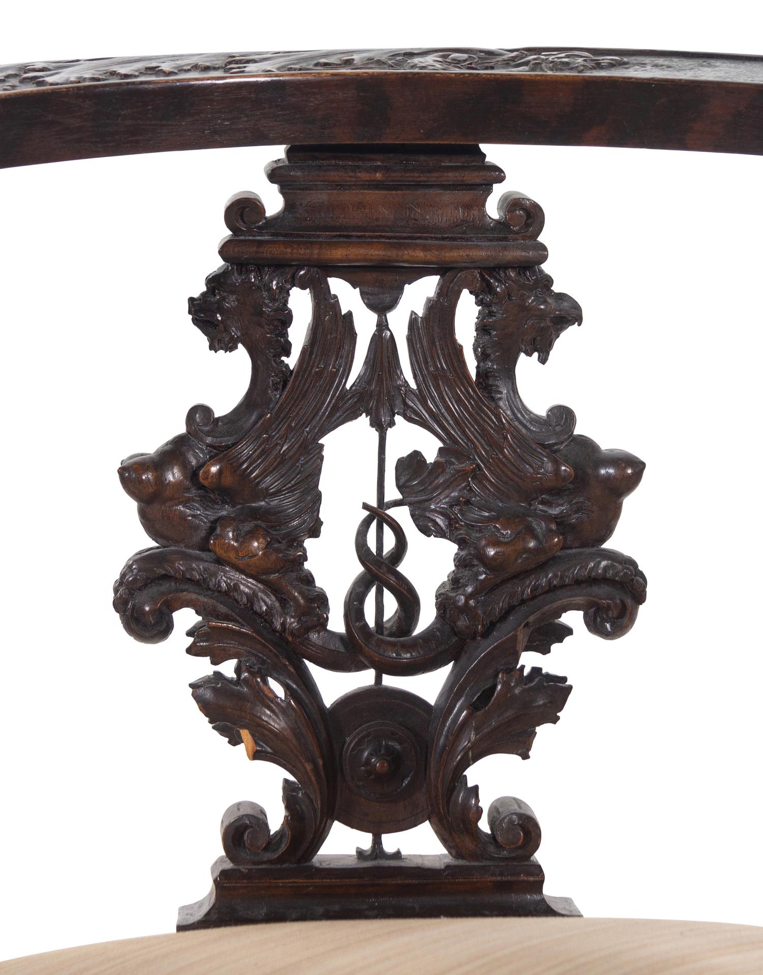 A Renaissance Revival Carved Walnut Corner Chair