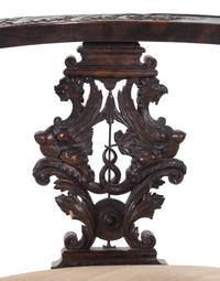 A Renaissance Revival Carved Walnut Corner Chair