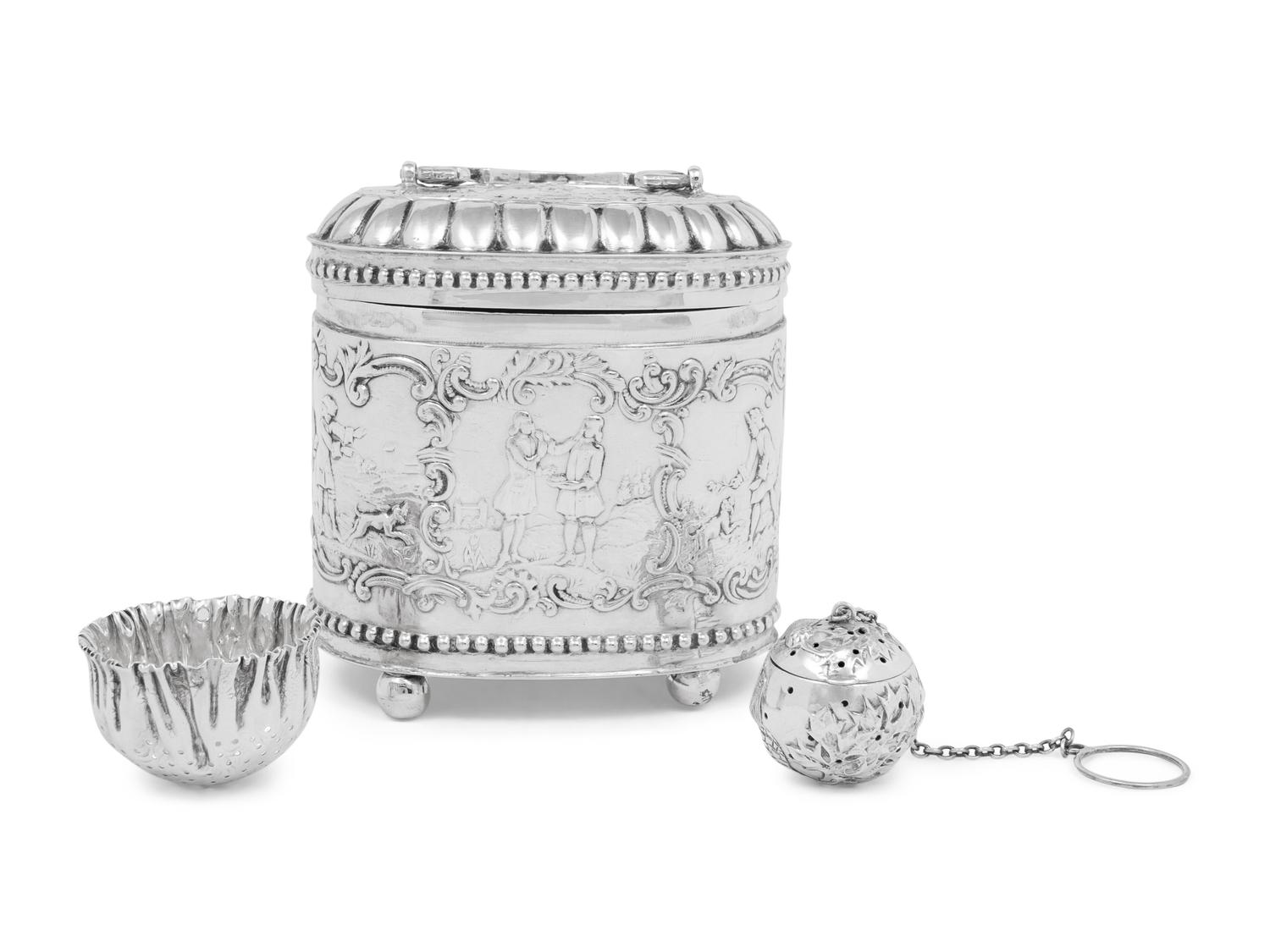 A Continental Silver Tea Caddy, Strainer and Tea Ball