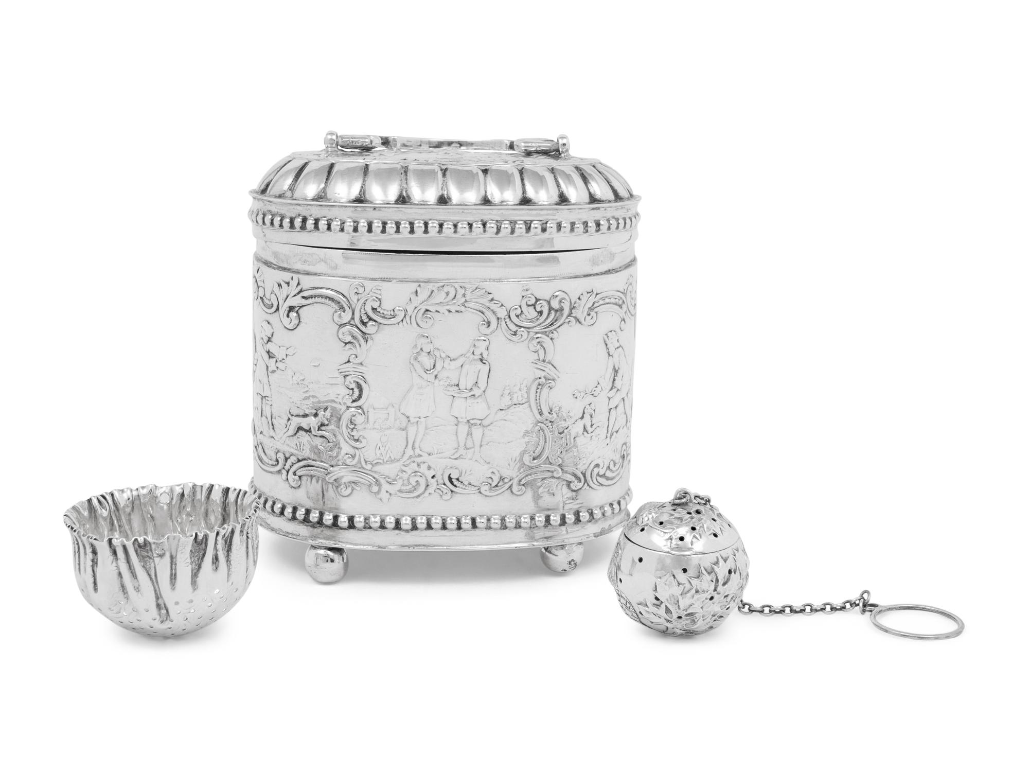 A Continental Silver Tea Caddy, Strainer and Tea Ball