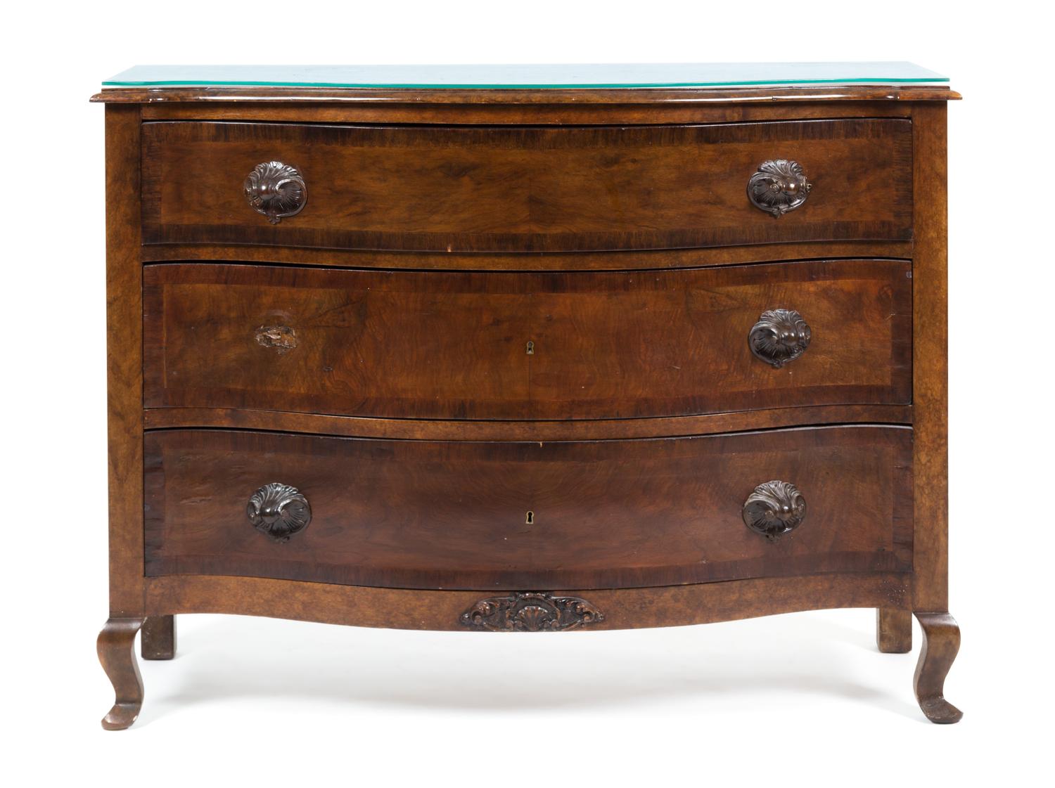 A Continental Walnut Chest of Drawers Height 35 1/2 x width 48 x depth 19 1/2 inches.