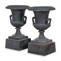 A Pair of Cast Iron Garden Urns and Plinths