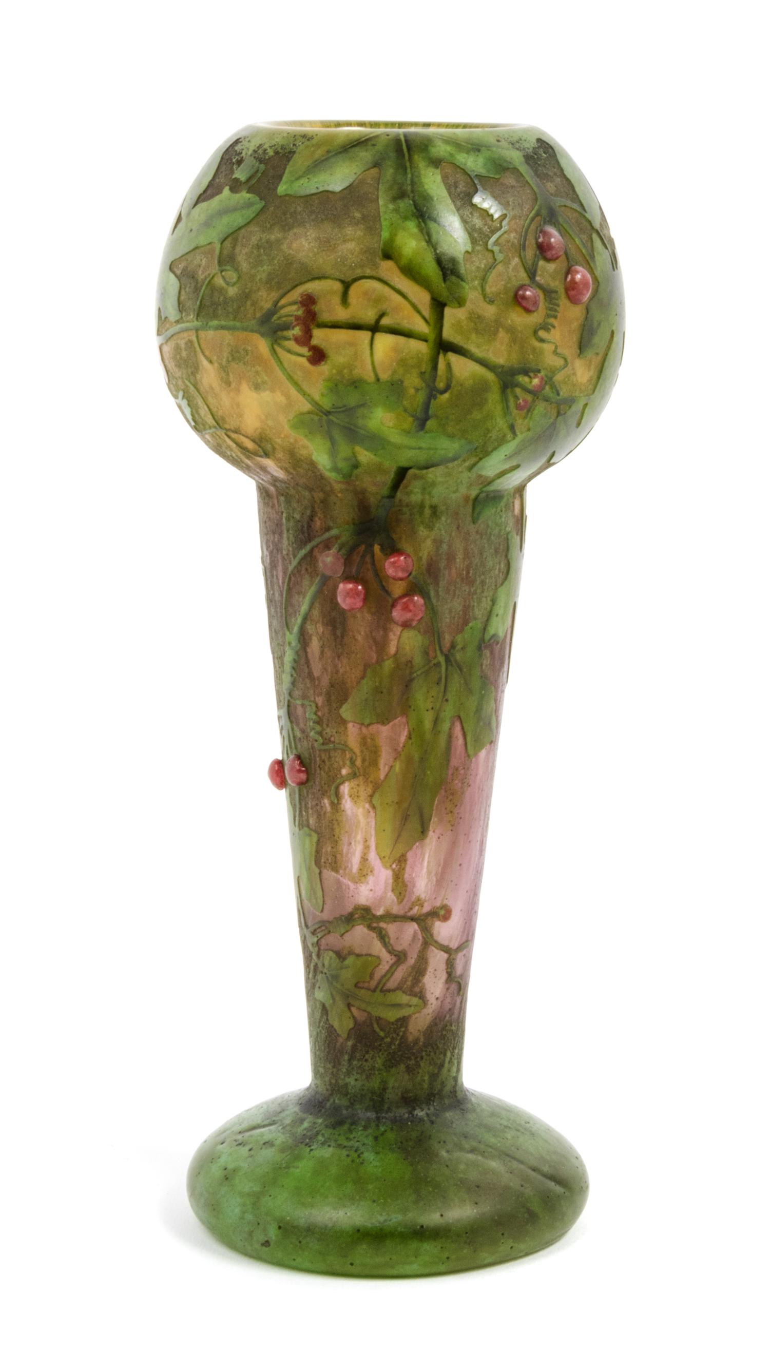 Daum, EARLY 20TH CENTURY, enameled and applied cameo glass vase, of baluster form decorated with berry laden leafy branches,
