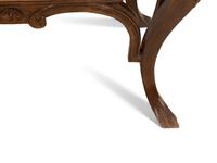 A Continental Gilt Metal Mounted Olivewood and Mahogany Bombé Commode