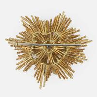 An 18K yellow gold, sapphire, diamond, and emerald starburst brooch Alessandria, Italy