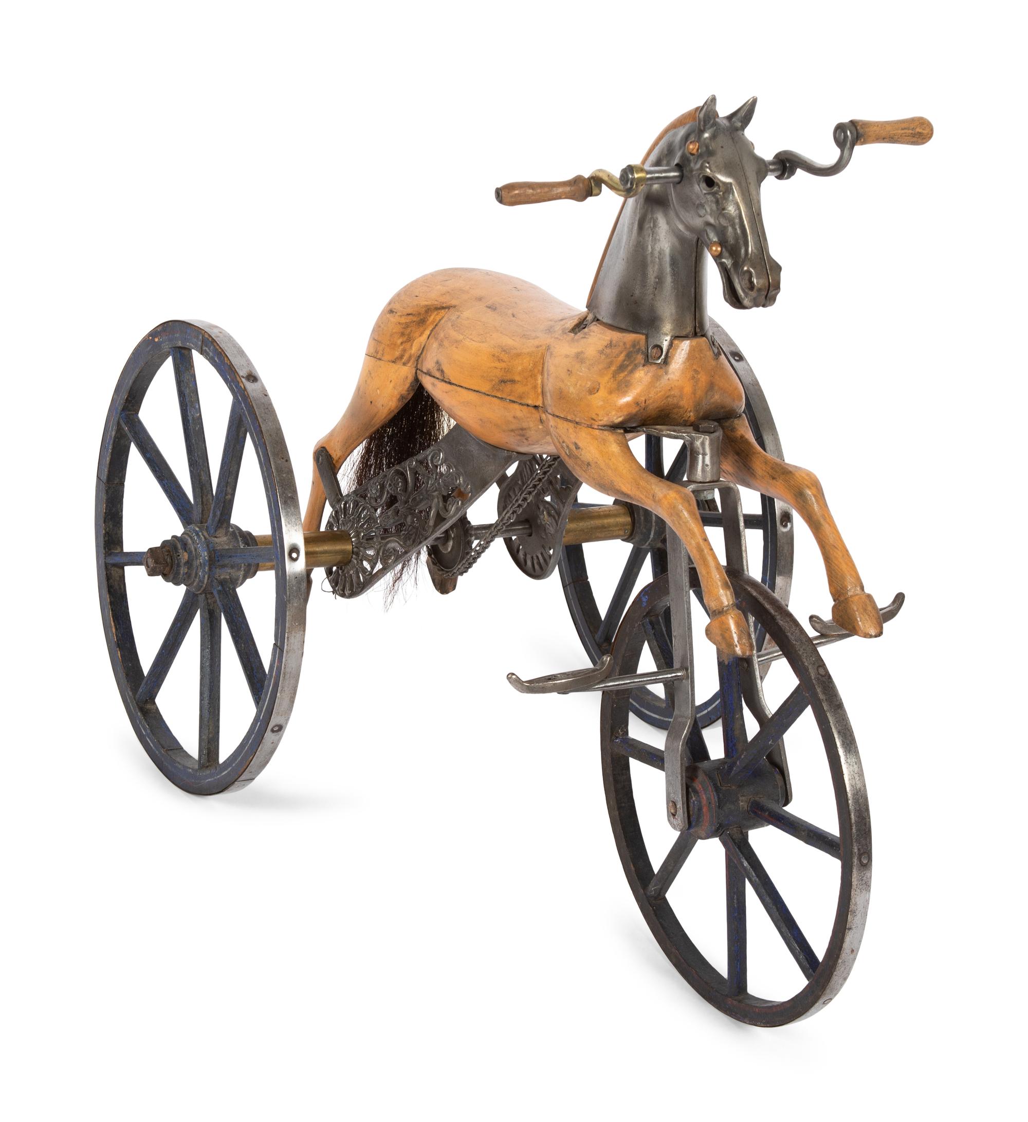A Carved Wood and Cast Metal Tricycle