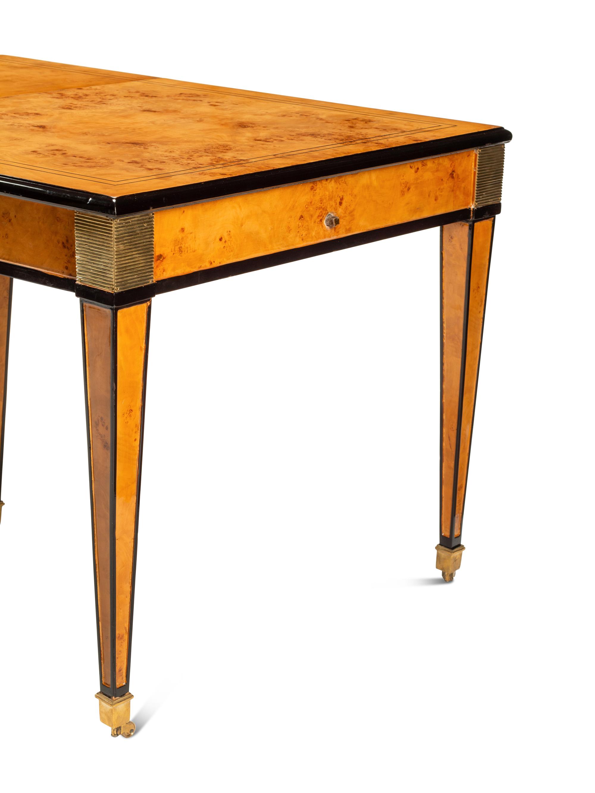 A Biedermeier Style Part-Ebonized Burlwood Dining Table