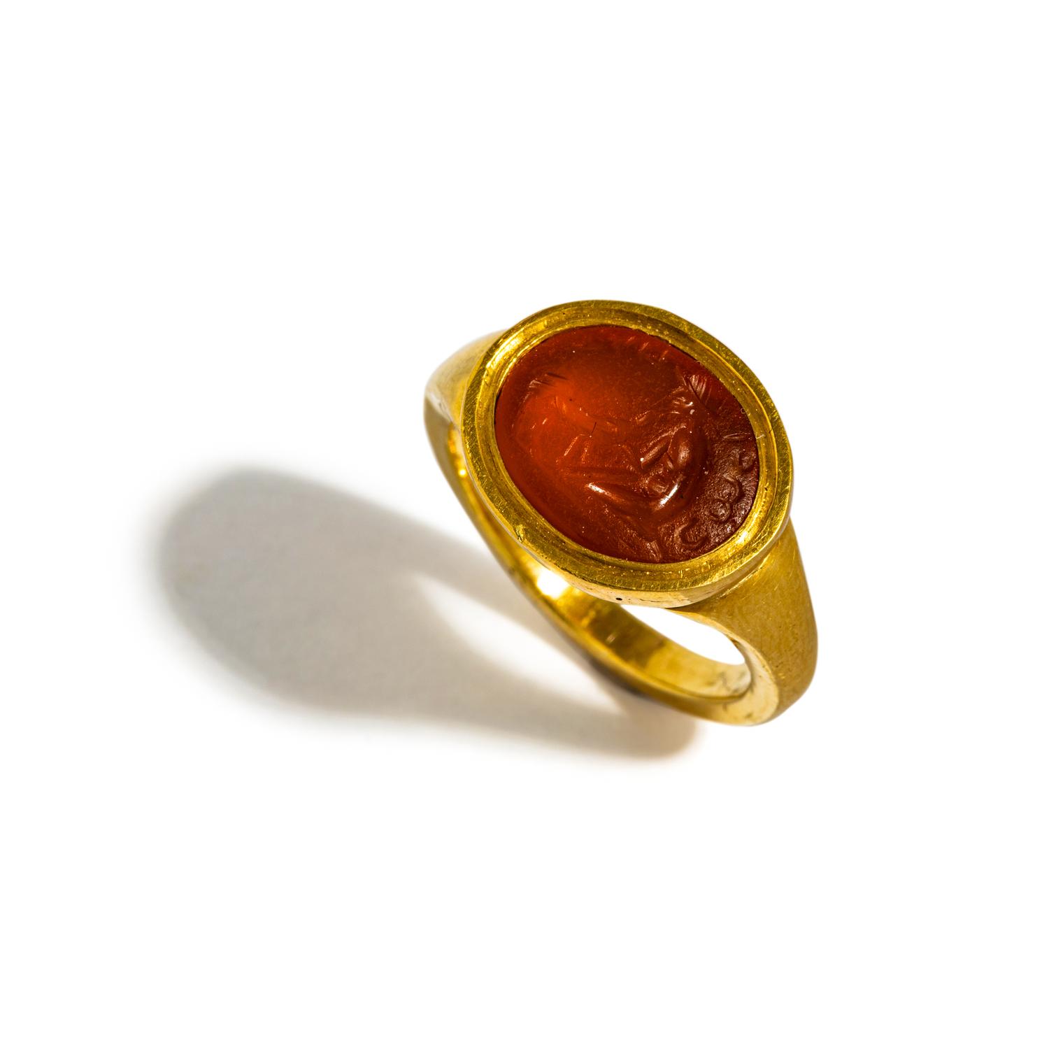 A Roman Carnelian Ring Stone with the God Mercury and a Sheep — Set in a gold ring