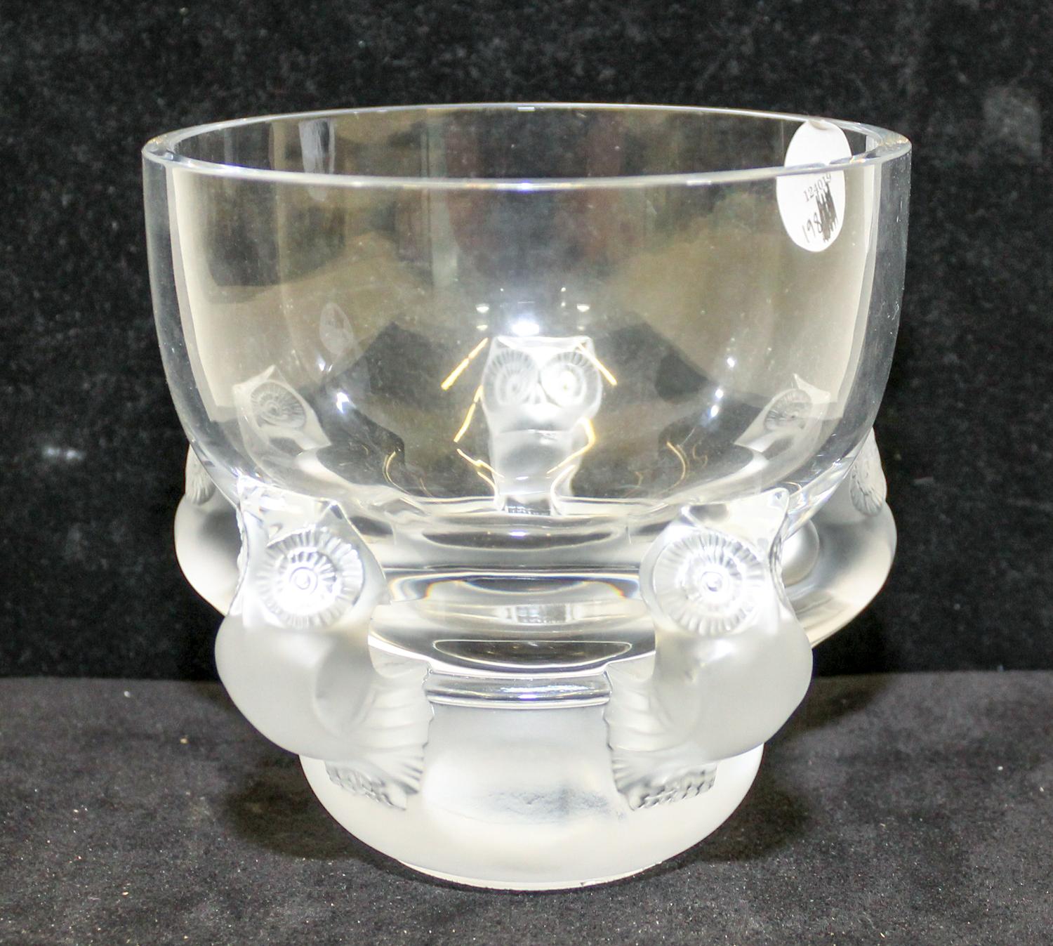 A Lalique Molded and Frosted Glass Vase. Height 5 1/2 inches.