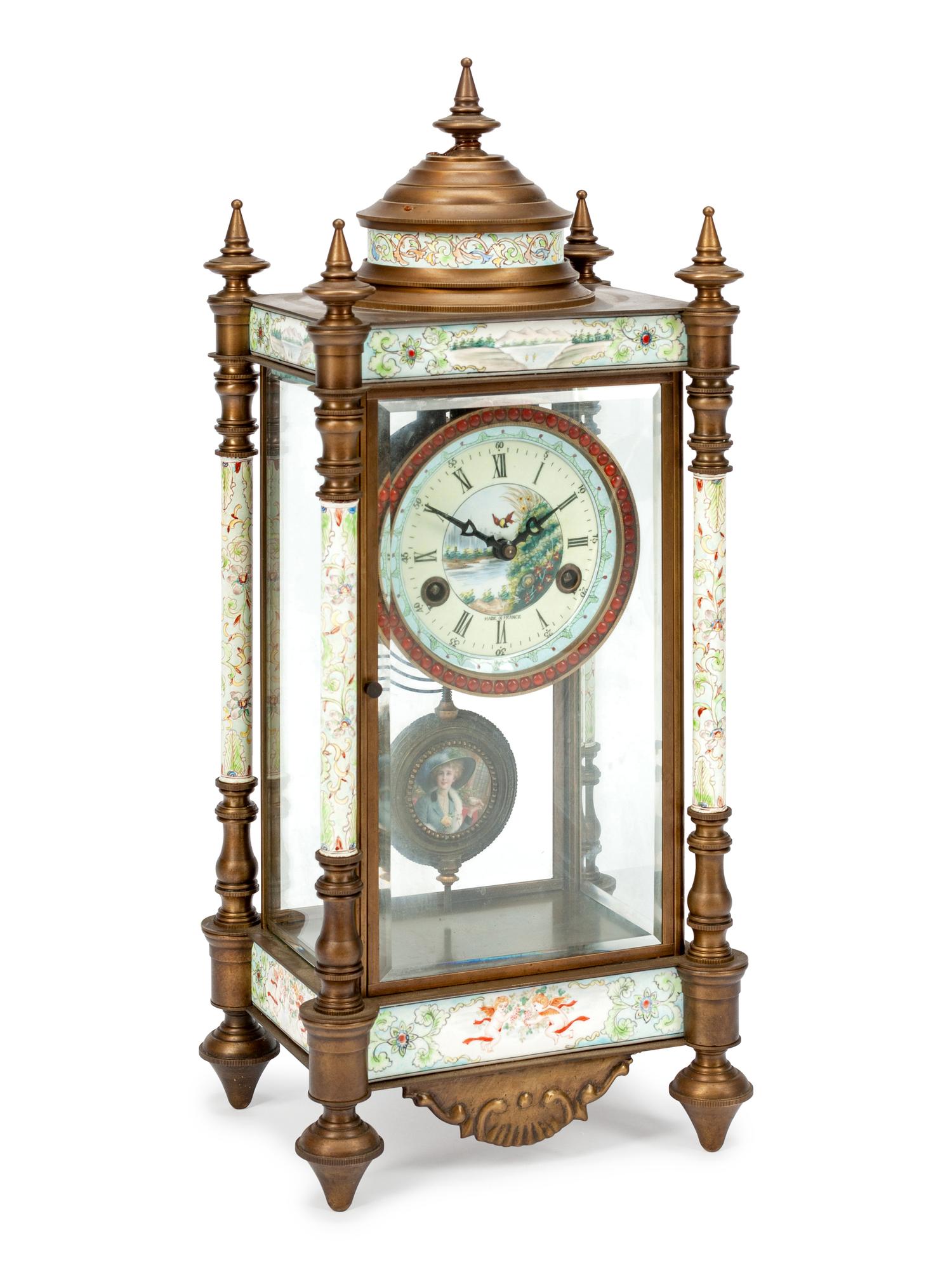 A Louis XVI Style Patinated Bronze Clock