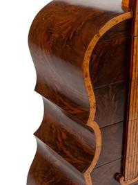 A Continental Burlwood and Walnut “Cello” Cabinet
