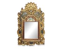 A rare Northern European polychrome and giltwood and églomisé courting mirror, early 18th century