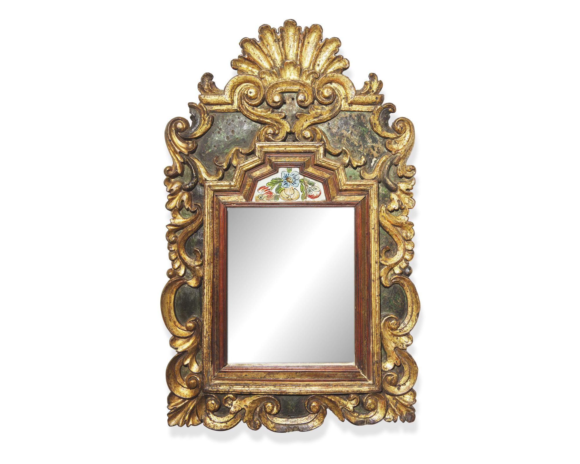 A rare Northern European polychrome and giltwood and églomisé courting mirror, early 18th century