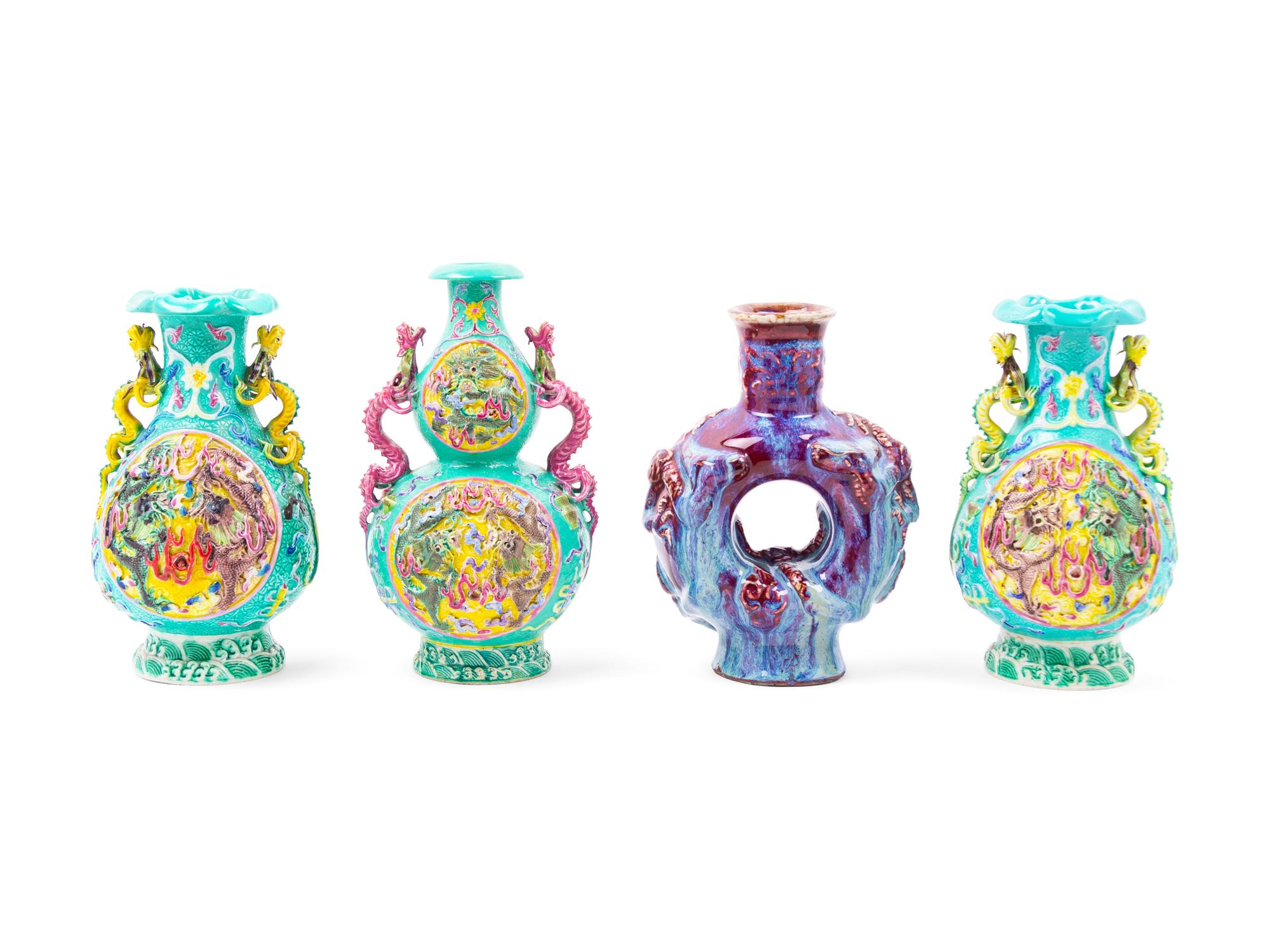 Four Chinese Carved Porcelain Vases