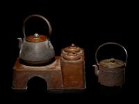 Four Japanese Cast Iron Teapots, Tetsubin , and Copper Burner Stand