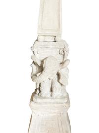 A Pair of Cast Stone Obebelisks on Elephant-Form Pedestals