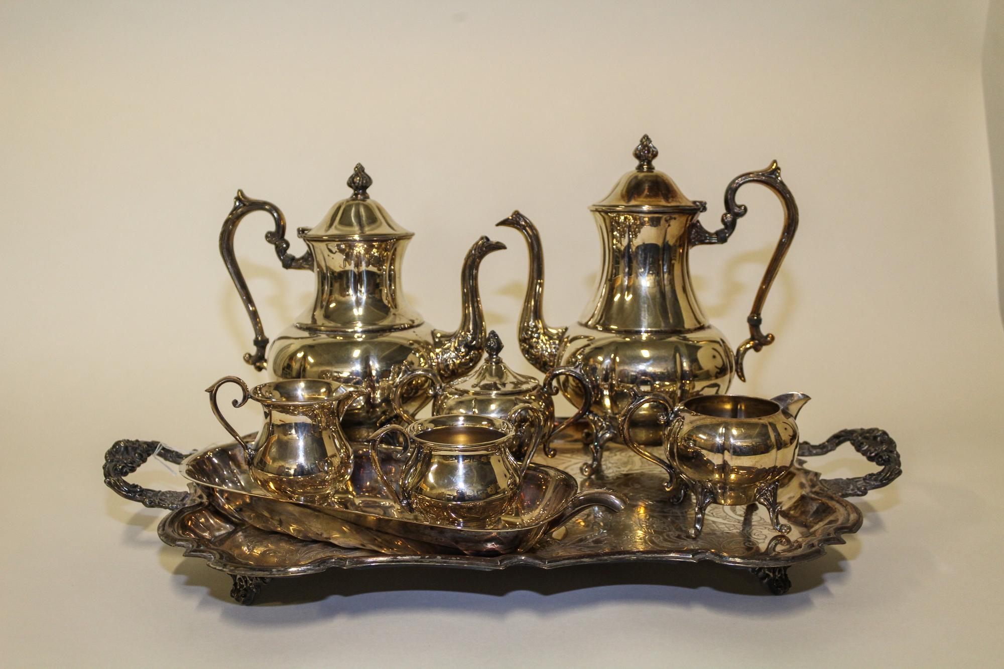 An American Silver-Plate Tea and Coffee Service, Sheridan, Taunton, MA, comprising a teapot, coffee pot, creamer, covered sugar and tra