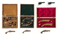 A Group of Cased Dueling Pistol Sets Width of widest case 2 1/4 inches. — George W. Jones and others