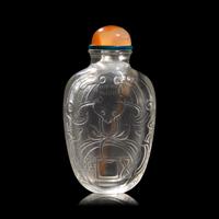 A Chinese Carved Rock Crystal "Bat and Coin" Snuff Bottle
