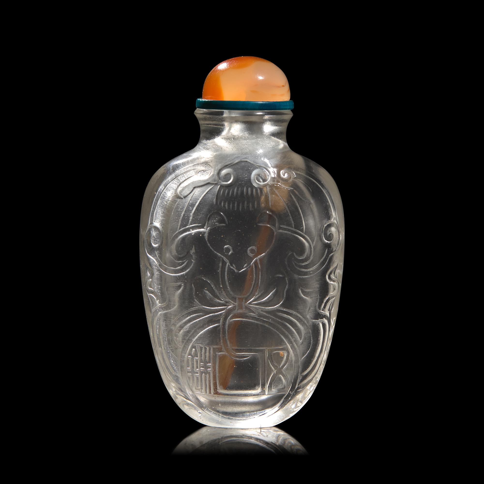 A Chinese Carved Rock Crystal "Bat and Coin" Snuff Bottle