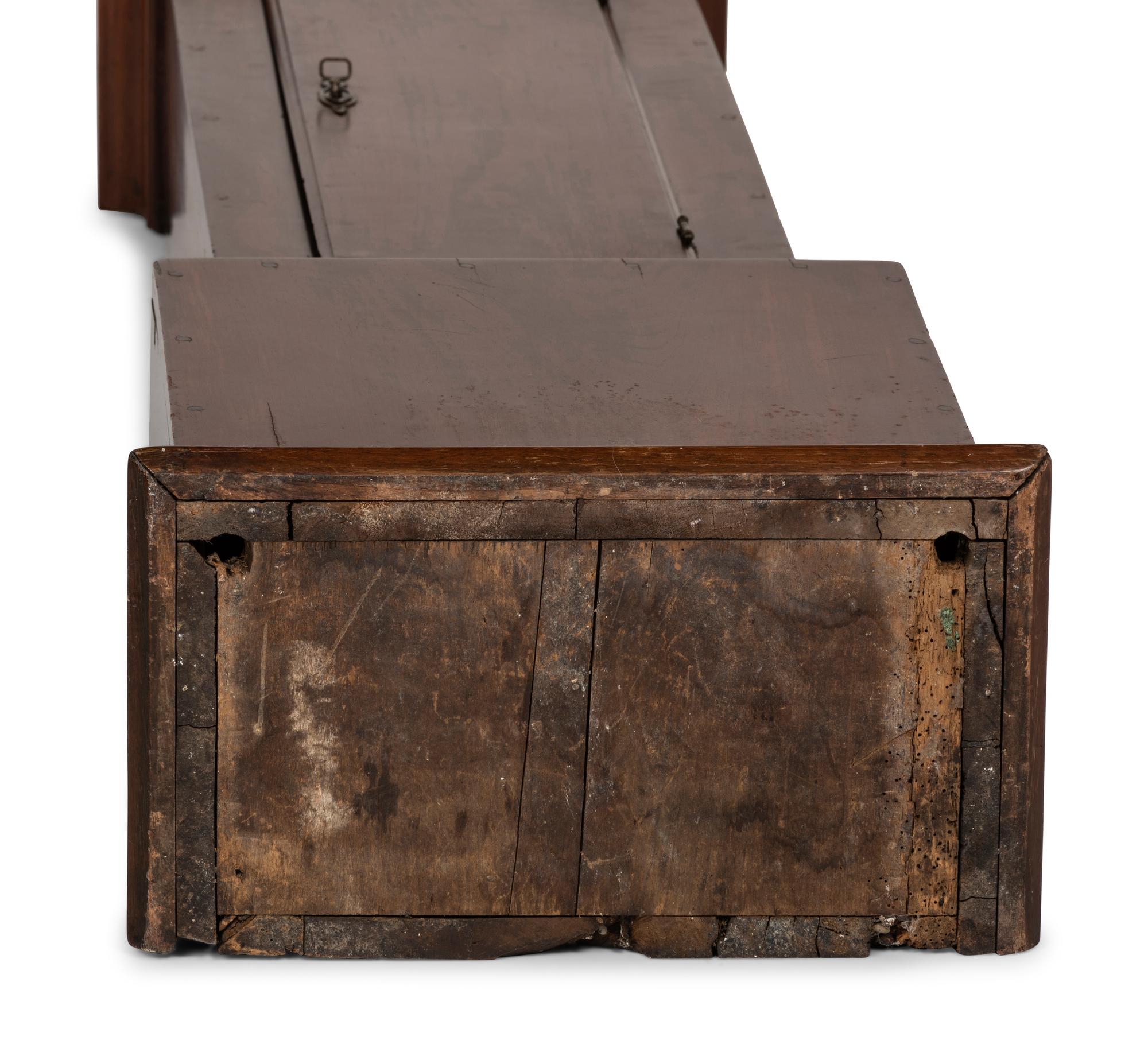 A Queen Anne Walnut Tall Case Clock