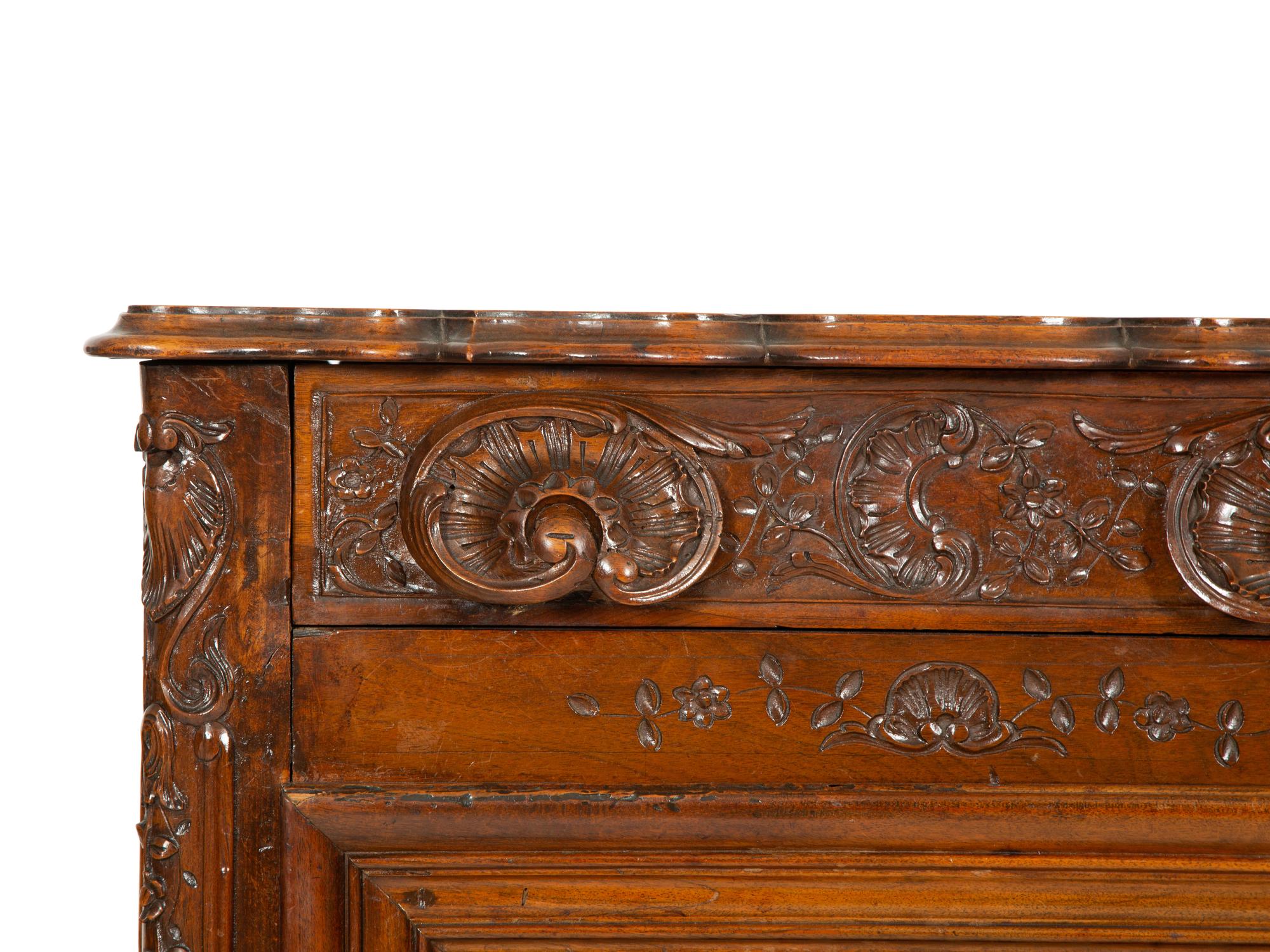 A French Provincial Carved Walnut Panettière