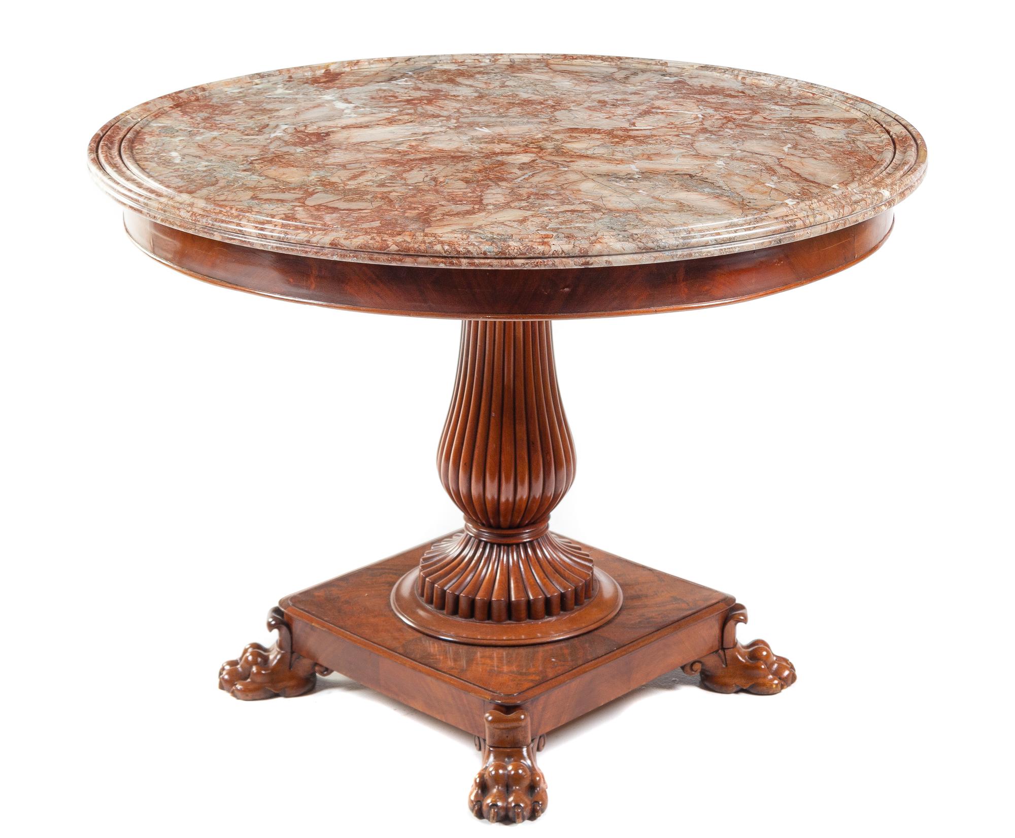 A Charles X Mahogany Center Table Height 30 1/2 x diameter of top 41 inches. — CIRCA 1840