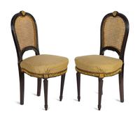 A Pair of Black Painted, Caned and Upholstered Side Chairs Height 37 x width 18 x depth 17 inches.