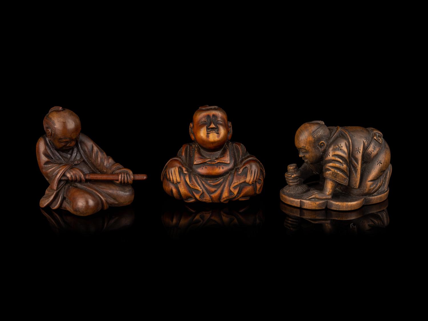 Three Japanese Carved Boxwood Figural-Form Netsuke