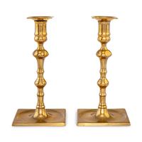 A Pair of George II Bell Metal Candlesticks