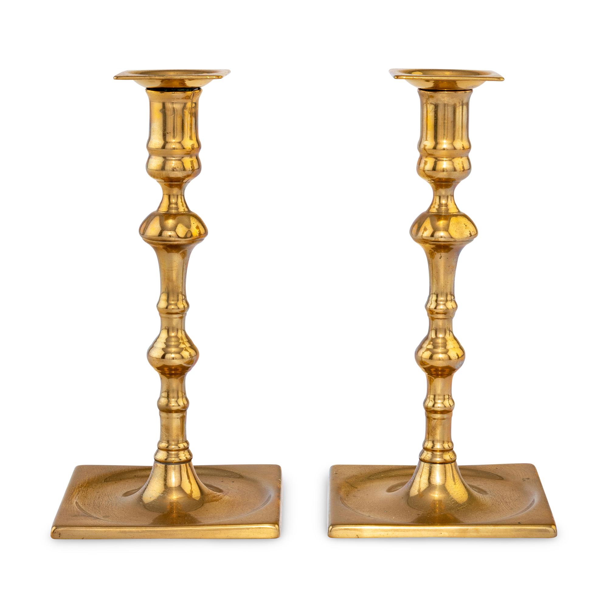 A Pair of George II Bell Metal Candlesticks