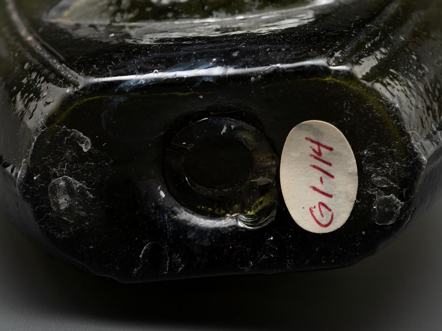 An Olive Green Glass Portrait Bust Flask